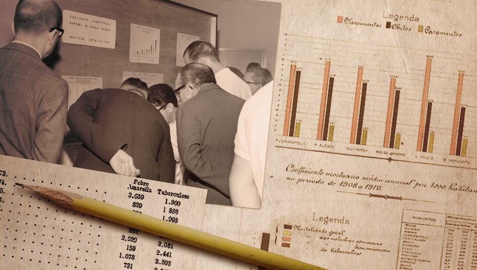 Foto de homens observam exposição sobre estatísticas: gráficos afixados num mural. Abaixo, documento mostra uma tabela. Ao lado, documento mostra um gráfico.