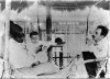 Carlos Chagas examining baby girl Rita, one of the cases of Chagas’s disease described by the scientist
In the background, the train car that served as dormitory and laboratory while Chagas was in the town of Lassance. Picture probably taken in 1909. Photo: Acervo COC
