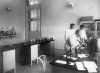 Oswaldo Cruz peering through a microscope
The public health specialist is standing next to his son Bento Oswaldo Cruz and Burle de Figueiredo, in one of the laboratories at Manguinhos Castle in 1910. Photo: Acervo COC